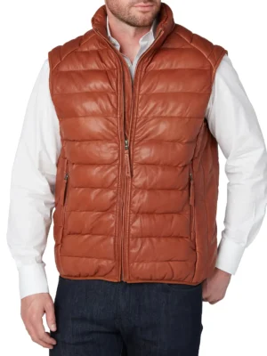 Man wearing a cognac leather puffer vest with front zipper, stand collar, and two pockets