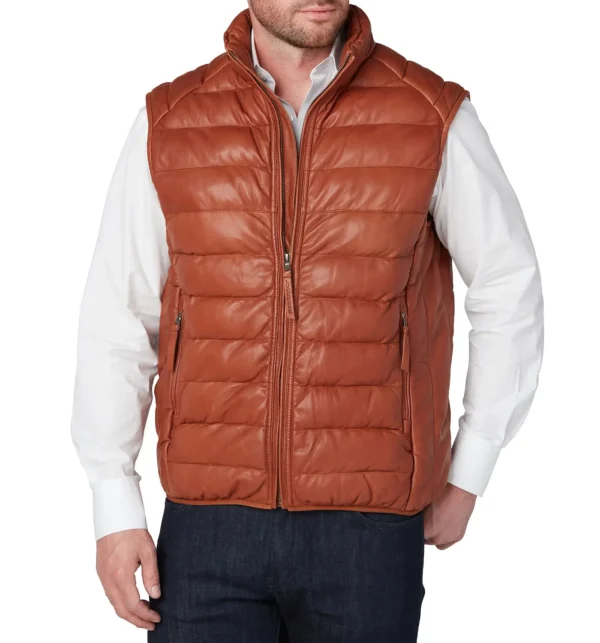 Man wearing a cognac leather puffer vest with front zipper, stand collar, and two pockets