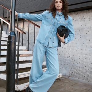 Front view of women’s eyelet detail denim jacket with boxy fit and silver hardware