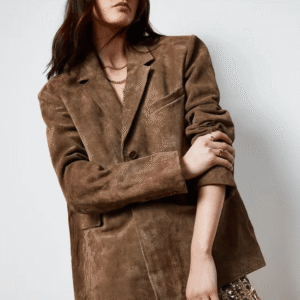 Model styling Real Suede Oversized Jacket with mini dress and boots for a chic night-out look