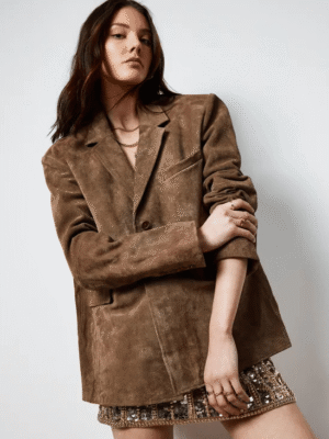Model styling Real Suede Oversized Jacket with mini dress and boots for a chic night-out look