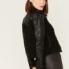 Women's black leather and suede jacket with zipper front, shirt collar, and front pockets