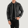 Cooper Black Leather Varsity Jacket Black leather varsity jacket with shirt collar, raglan sleeves, and quilted lining