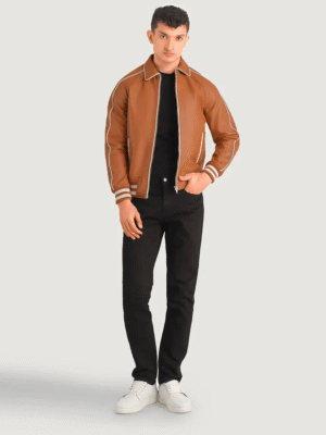 Tan brown leather varsity jacket with shirt collar, raglan sleeves, and quilted lining