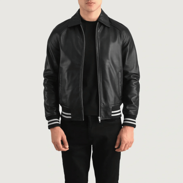 Black leather varsity jacket with shirt collar, rib-knit cuffs, and quilted lining
